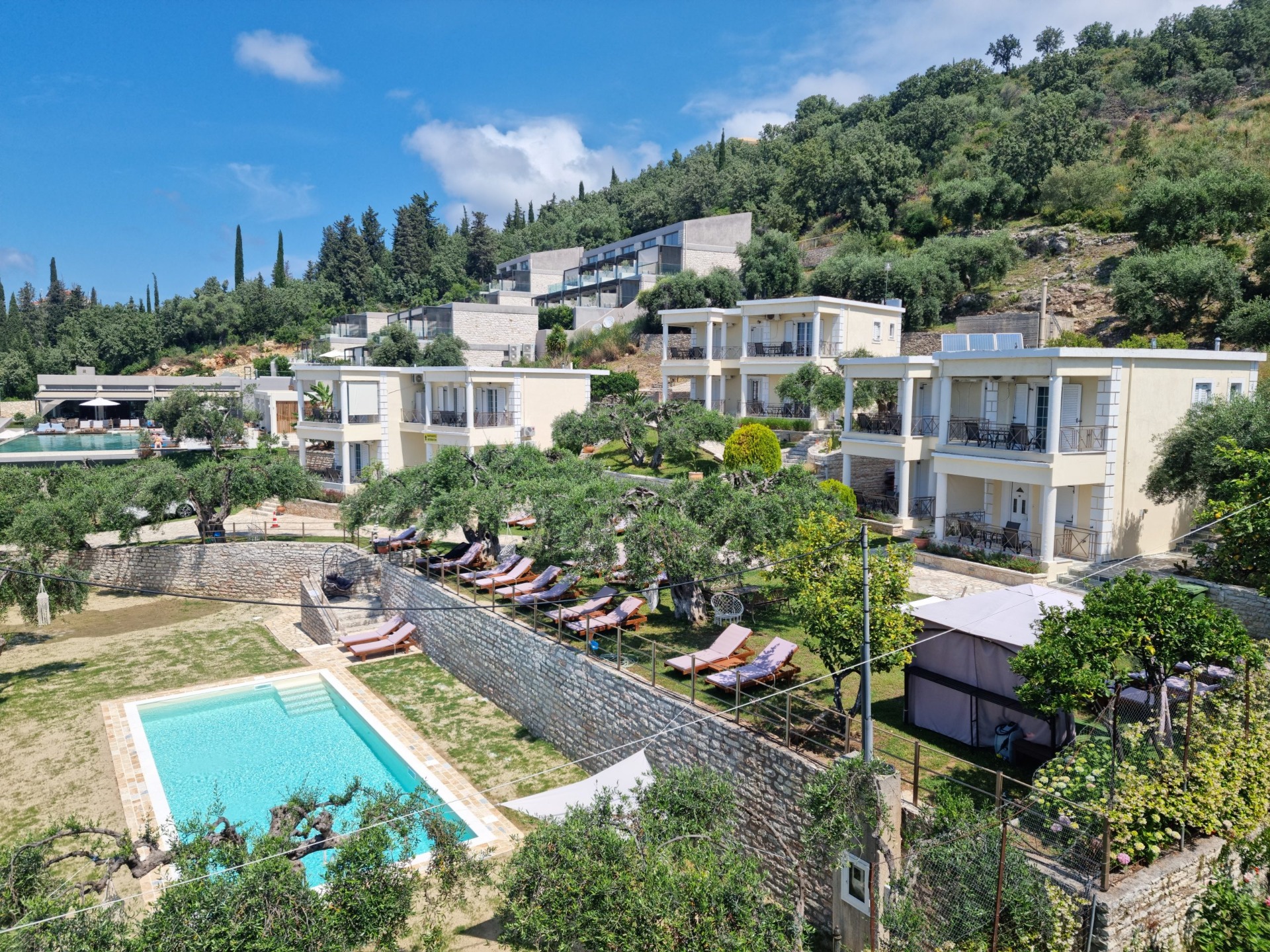 Exterior view of Eleonas Estate accommodation with swimming pool in Sivota, Greece