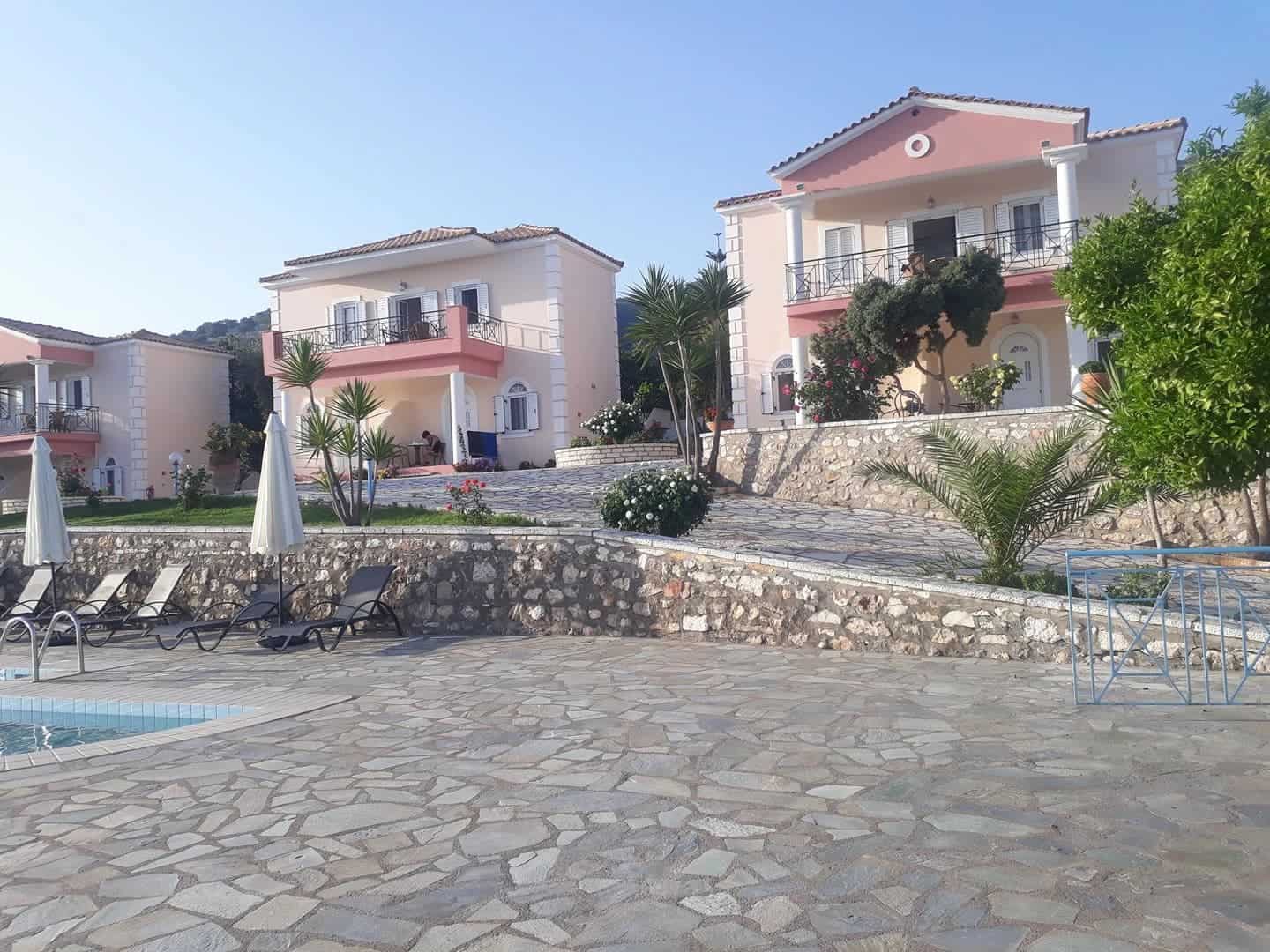 Outdoor pool and stone terrace at Dallas Studios in Sivota, Greece