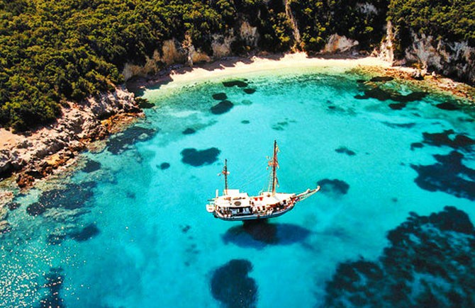 Pisina Beach in Sivota with crystal clear turquoise water and natural pool-like scenery accessible by boat